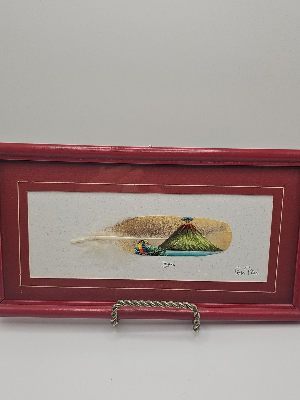HandCrafted Feather Art with Volcano and Paint On Bird Feather. Folk Art